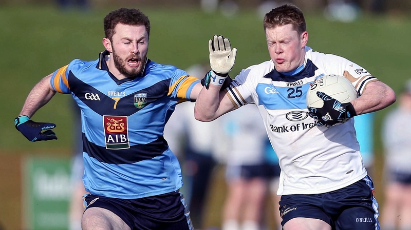 UUJ's Ryan McAnspie (R) is tackled by UCD's Jack McCaffrey