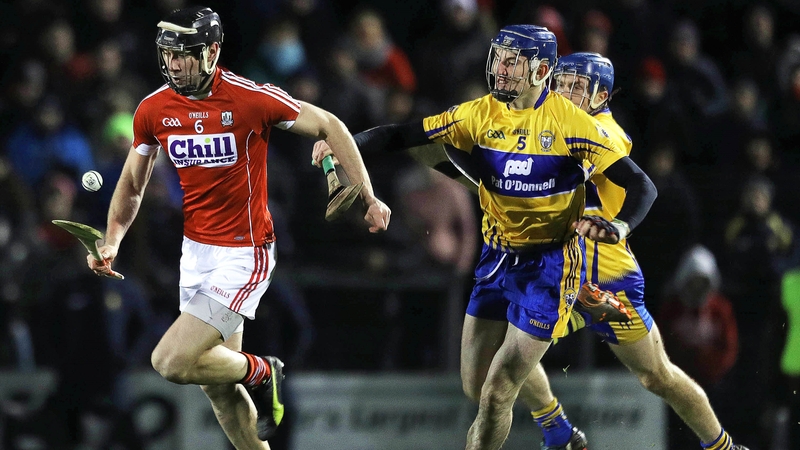 Mark Ellis evades the challenge of Clare's David Fitzgerald