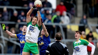 Donegal's Michael Murphy battles for possession with Kevin Higgins and Tadgh O'Rourke