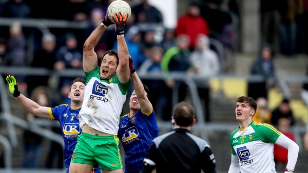 Donegal's Michael Murphy battles for possession with Kevin Higgins and Tadgh O'Rourke