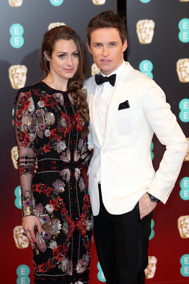 Hannah Bagshawe and Eddie Redmayne got a babysitter for little Iris and are all ready for a very special date night hosted by Stephen Fry. Hannah is wearing Alexander McQueen and we love that loose plait.