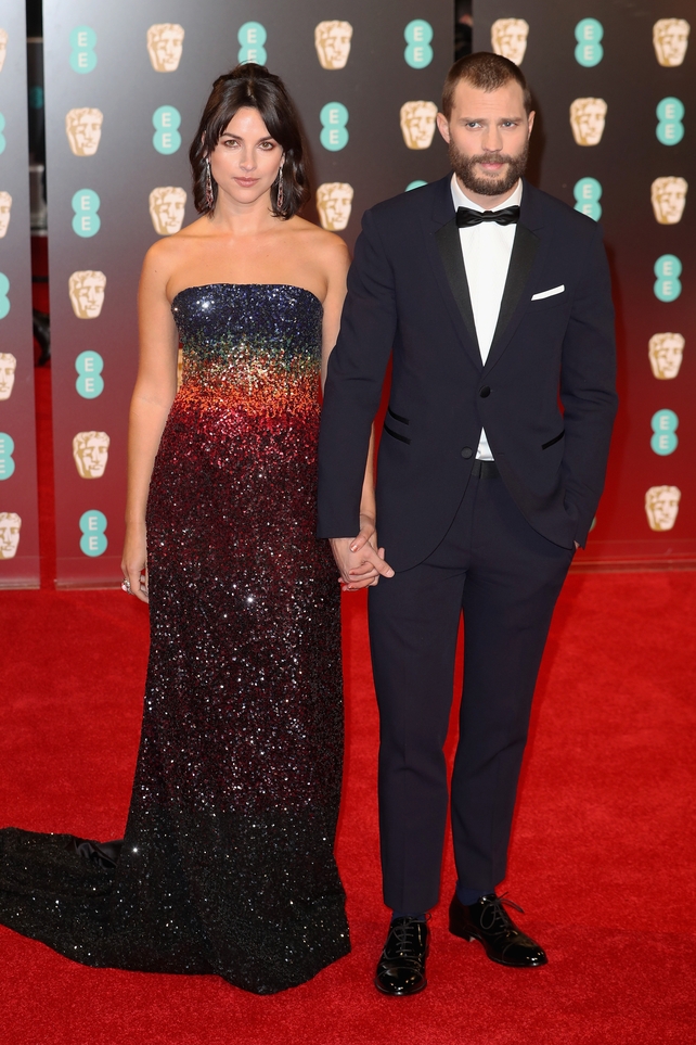 Another striking couple pose for the cameras - this time its our own Jamie Dornan and his wife Amelia Warner.