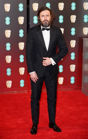 A bearded Casey Affleck is almost unrecognisable in Louis Vuitton. Perhaps its the look the Bafta nominee needs for his current role in Light of My Life?