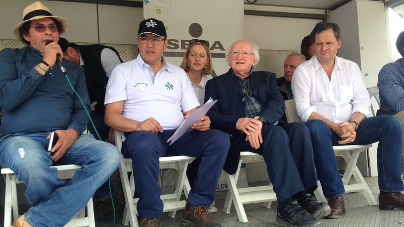 Michael D Higgins listens to an address by FARC commander Pastor Alape during his visit to a demobilisation camp