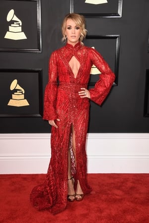 Miss: American singer/songwriter Carrie Underwood is lost in this fussy Elie Madi gown.
