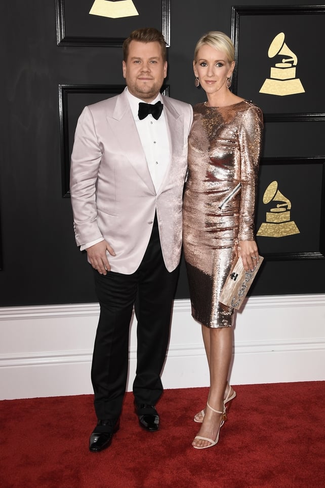Grammys host James Corden with his wife Julia Carey are perfectly co-ordinated in shimmery gold.