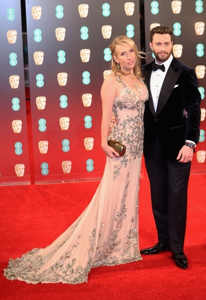 Sam Taylor-Johnson and Aaron Taylor-Johnson make a dashing couple. Sam looks etheral in an embellished Tom Ford.