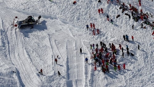 Rescue workers search for ski group after avalanche