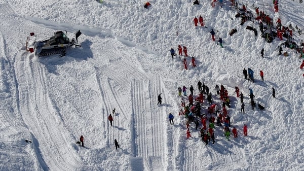 Rescue workers search for ski group after avalanche