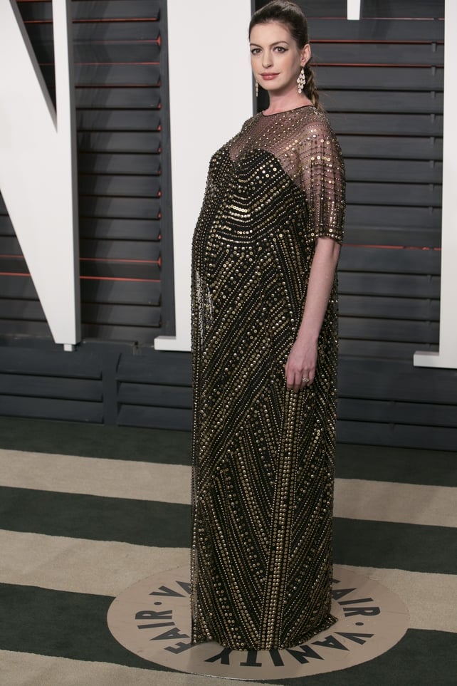 Anne is giving us Cleopatra vibes in this Naeem Khan black and gold dress and dramatic eye-liner. She looks radiant while pregnant at the 2016 Vanity Fair Oscar Party.