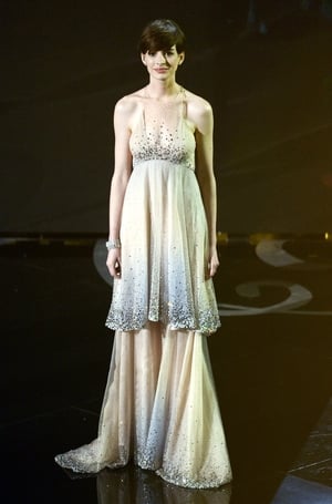 Anne performed onstage at the ceremony in 2013 with the 'Les Miserables' cast in a beautiful Giorgio Armani milky way-like dress, the same year she won the Oscar. Out of this world.