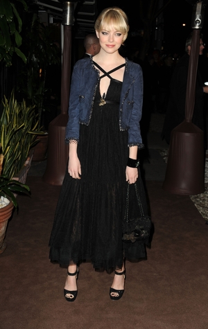 Emma at the Chanel and Charles Finch Pre-Oscar Dinner in 2011 in... Chanel of course! She twisted the dress' style with a blue navy jacket! #Lovinher