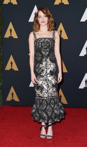 The actress looking chic in a silver flower pattern Erdem dress enhanced by wavy hair and fresh make-up at the Oscars Governors Awards in 2016.