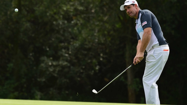 Padraig Harrington escapes a bunker on the 12th hole
