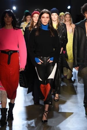 February 13th Day 5: Bella Hadid stands out from the crowd with red make-up and leather pants at the Zadig & Voltaire show.