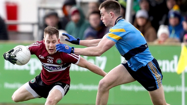 St Mary's Kieran McGeary is tackled by Jack Barry of UCD