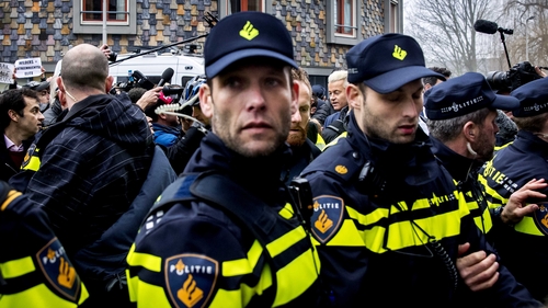 Dutch police surround the leader of the Party for Freedom (PVV) Geert Wilders during a walkabout