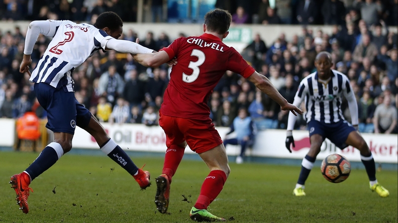 Millwall's Shaun Cummings (L) scores the winner