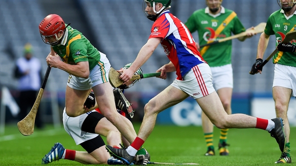 Carrickshock's John Tennyson with Cathal Mannion of Ahascragh Fohenagh