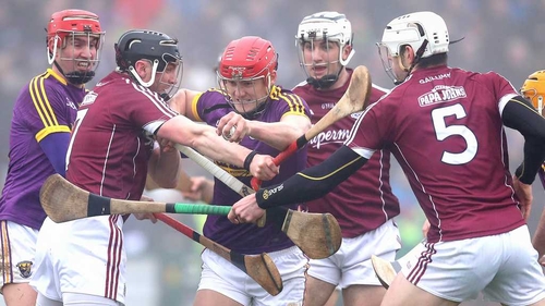 Lee Chin tries to force his way through three Galway players