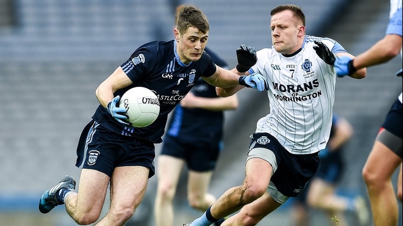 Westport's Brian McDermott with Joe Sweeney of St Colmcille's