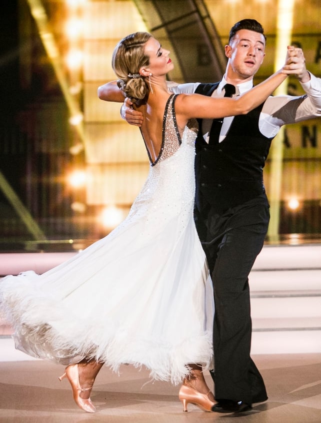 Week 7: Aoibhín looks like a 1920's screen siren. The hair, make up and backless white gown with feather detail has blown us away. Her foxtrot with Kai was stunning!