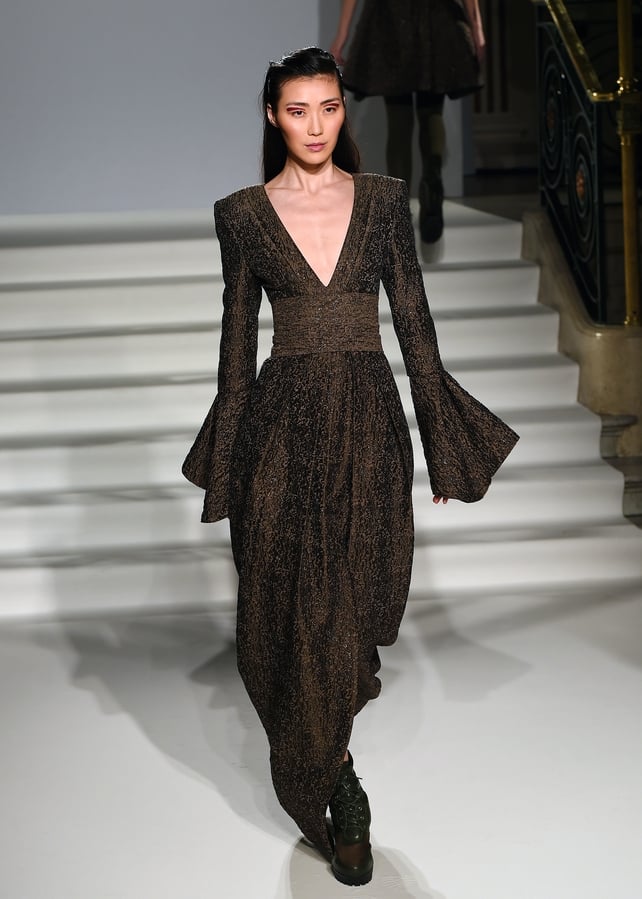 Extra large sleeves, plunging neckline and tight waist for Irish designer Paul Costelloe.