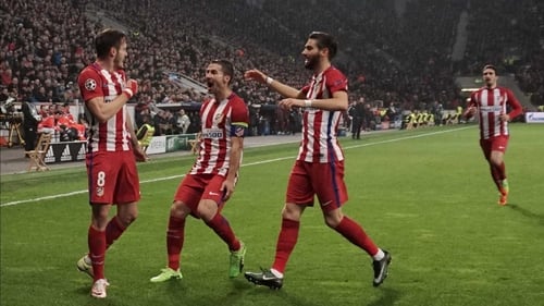 Saul Niguez (L) and team mates celebrate
