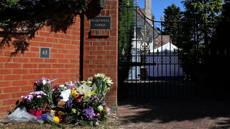 Floral tributes left outside the home of Helen Bailey after her body was discovered there last year