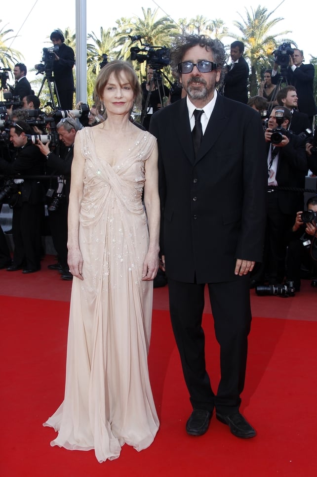 Wearing a romantic off-white dress while posing with director Tim Burton at the 2010 Festival de Cannes.