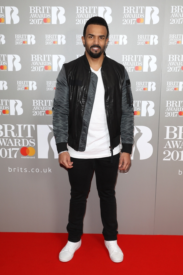 Craig David is looking slick in the whitest runners we've eva seen.