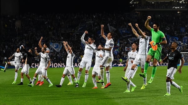 Juventus players celebrate in front of their fans at the end