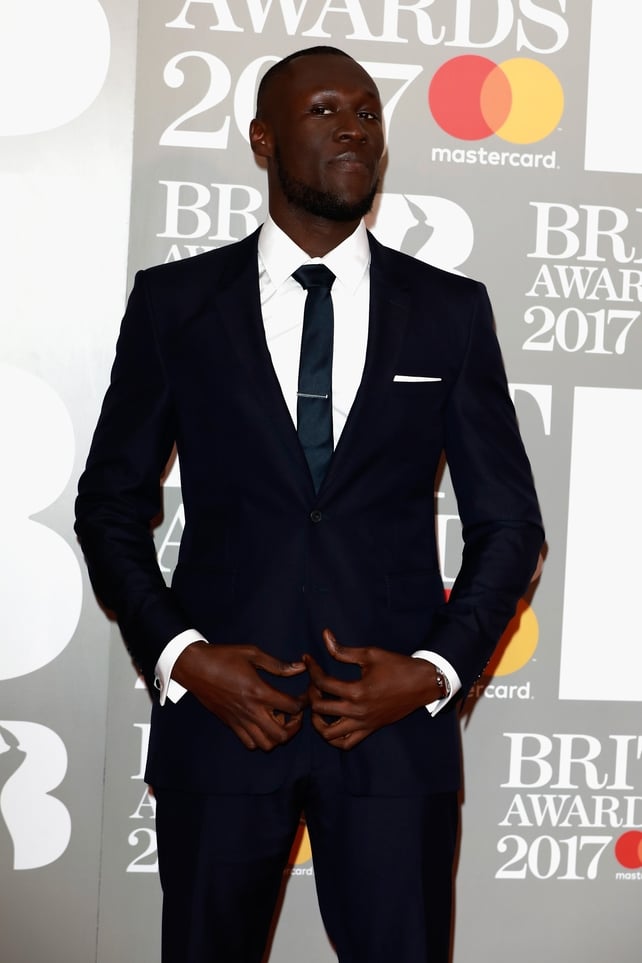 Stormzy looking super classy and a suit and tie before killing it on stage with Ed Sheeran!