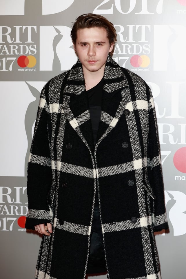 Brooklyn Beckham in a very prominent coat! How grown up does he look?!