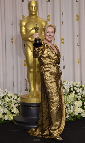 The Golden Lady! Meryl Streep won the statuette for her role in 'The Iron Lady' in 2012. She wore a Lanvin gown to match her award!
