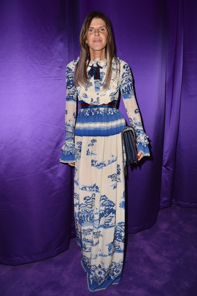 Fashion icon and Vogue Japan Editor Anna Dello Russo in a printed maxi dress attending the Gucci fashion show.