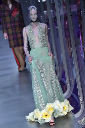 Beautiful shimmering dress at the Gucci fashion show. Face-covering accessory? Optional.