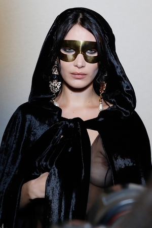 Sicilian Madonna. Bella Hadid is unrecognizable behind her mask at the Alberta Ferretti show.