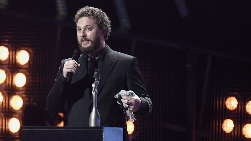 David Bowie's son Duncan Jones accepting one of his late Dad's awards at the Brits