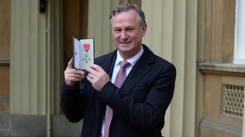 Michael O'Neill poses with his medal