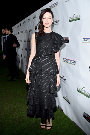 Caitriona Balfe looks fabulous in frills. We have a feeling one shoulder dresses are the trend to watch.