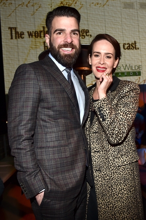 Zachary Quinto and actress Sarah Paulson. Red lips? Check. Statement coat? Check. We're sensing a trend here people.