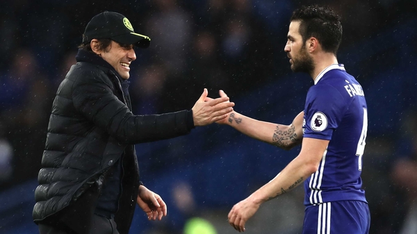 Antonio Conte congratulates Cesc Fabregas after the final whistle