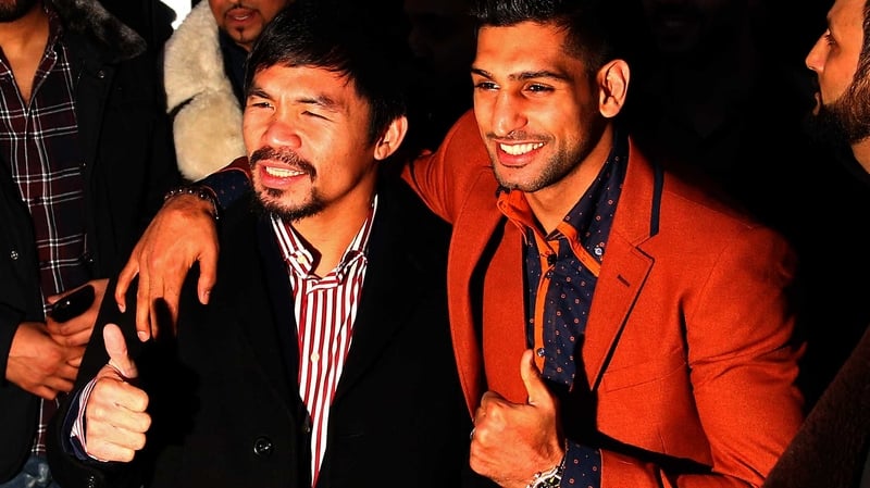 Amir Khan (R) wants to fight Manny Pacquiao (L) before hanging up his gloves