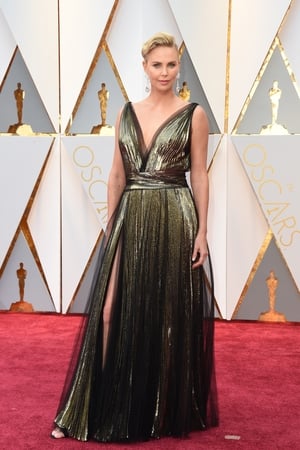 Charlize Theron opted for a thigh high split and plunging v-neck in this Christian Dior gown.