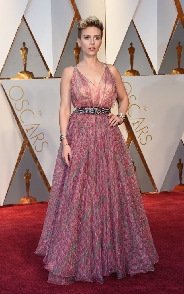 Scarlett Johansson in a soft floral Azzedine Alaia dress and studded belt.
