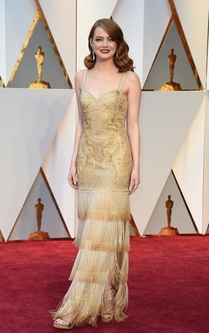 La La Land nominee Emma Stone stuns in fringed Givenchy Haute Couture.