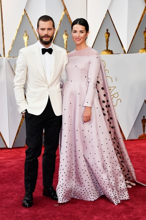 ...a baby pink, floor-skimming gown with embellished detail and added cape which was also timeless elegance at its best.