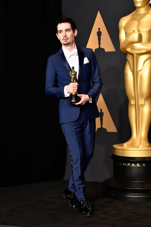La La Land's Damien Chazelle poses in the press room with the Oscar for Best Director