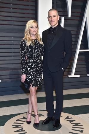 Reece Witherspoon wore a long sleeved Michael Kors number to the Vanity Fair party with Jim Toth.